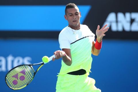 MELBOURNE, AUSTRALIA - JANUARY 21:  Nick Kyrgios of Australia plays a forehand in his second round match against Ivo Karlovic of Croatia during day three of the 2015 Australian Open at Melbourne Park on January 21, 2015 in Melbourne, Australia.  (Photo by Patrick Scala/Getty Images)