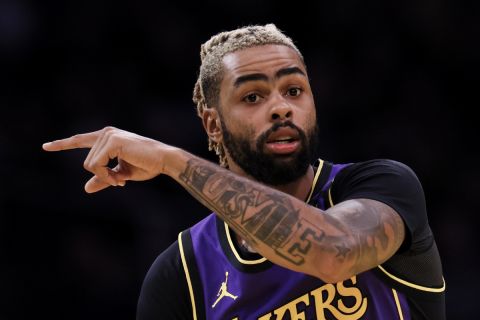 Los Angeles Lakers guard D'Angelo Russell reacts during the second half of an Emirates NBA Cup basketball game against the Utah Jazz, Tuesday, Nov. 19, 2024, in Los Angeles. (AP Photo/Etienne Laurent)