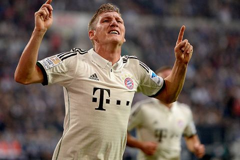 GELSENKIRCHEN, GERMANY - SEPTEMBER 21:  Bastian Schweinsteiger of Bayern Muenchen celebrates his team's first goal during the Bundesliga match between FC Schalke 04 and FC Bayern Muenchen at Veltins-Arena on September 21, 2013 in Gelsenkirchen, Germany.  (Photo by Dennis Grombkowski/Bongarts/Getty Images)