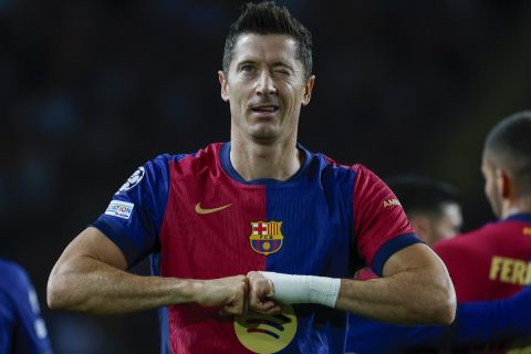 Barcelona's Robert Lewandowski celebrates after scoring his side's opening goal during the Champions League soccer match between Barcelona and Young Boys at the Lluis Companys Olympic Stadium in Barcelona, Spain, Tuesday, Oct. 1, 2024. (AP Photo/Joan Monfort)