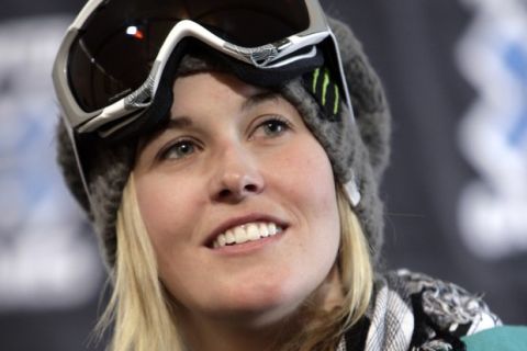 FILE - In this Wednesday, Jan. 21, 2009, file photo, skier Sarah Burke of Canada looks on during a news conference at the Winter X Games, in Aspen, Colo. Burke will be competing in the Skiers SuperPipe at this weekends competition. Burke died Jan. 19, 2012, nine days after a training accident on a halfpipe in Park City, Utah, and about nine months after the International Olympic Committee said "yes" to her longtime dream. Burke's friends will bring their snowflakes to the Olympic Games in Sochi, Russia, wearing necklaces shaped like the snowflake tattoo the late Canadian star had etched on her foot. (AP Photo/Nathan Bilow, File) ORG XMIT: NY112