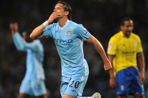 Manchester City's Canadian-English midfielder Owen Hargreaves celebrates scoring the opening goal of the 3rd round league cup football match between Manchester City and Birmingham City at Etihad Stadium in Manchester, north-west England on September 21, 2011. AFP PHOTO/ANDREW YATES

RESTRICTED TO EDITORIAL USE. No use with unauthorized audio, video, data, fixture lists, club/league logos or live services. Online in-match use limited to 45 images, no video emulation. No use in betting, games or single club/league/player publications. (Photo credit should read ANDREW YATES/AFP/Getty Images)