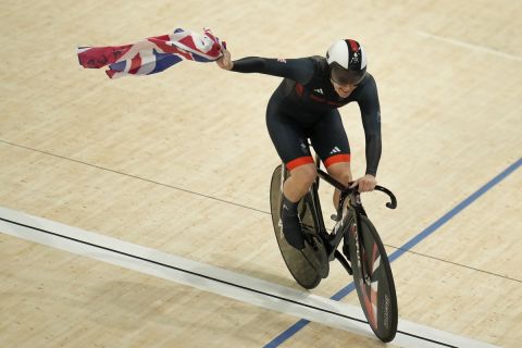 Katy Marchant of Team Britain celebrates winning the gold medal in the women's team sprint event, at the 2024 Summer Olympics, Monday, Aug. 5, 2024, in Paris, France. (AP Photo/Ricardo Mazalan)