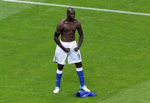 Italy's Mario Balotelli celebrates scoring his side's second goal during the Euro 2012 soccer championship semifinal match between Germany and Italy in Warsaw, Poland, Thursday, June 28, 2012. (AP Photo/Vadim Ghirda) 