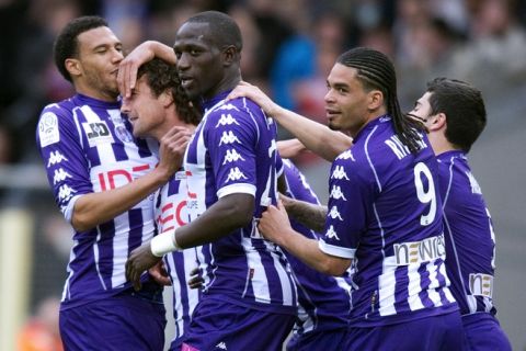 Toulouse's midfielder Gilles Siriex (2ndL) celebrates with his teammates after scoring a goal during the French L1 football match Toulouse vs Lyon, on April 18, 2012 at the Stadium Municipal in Toulouse, southwestern France.  AFP PHOTO/ PASCAL PAVANI (Photo credit should read PASCAL PAVANI/AFP/Getty Images)