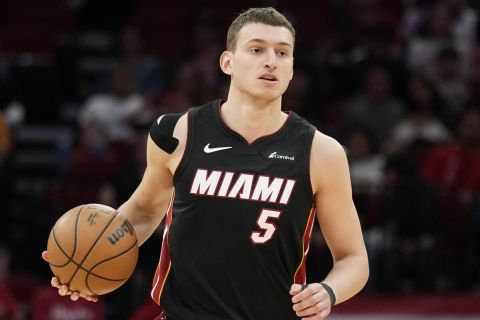 Miami Heat forward Nikola Jovic (5) dribbles against the Houston Rockets during the first half of an NBA basketball game Friday, April 5, 2024, in Houston. (AP Photo/Eric Christian Smith)