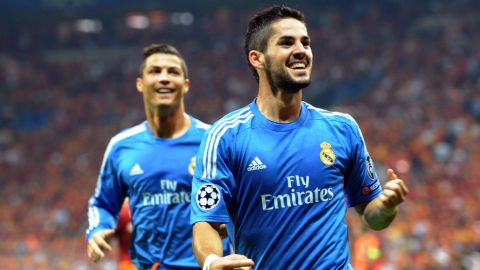 Real Madrid's Isco (R) celebrates with his Portuguese teammate Cristiano Ronaldo after scoring during the UEFA Champions League football match Galatasaray vs Real Madrid on September 17, 2013 at the TT Arena Stadium in Istanbul.     AFP PHOTO/ OZAN KOSEOZAN KOSE/AFP/Getty Images