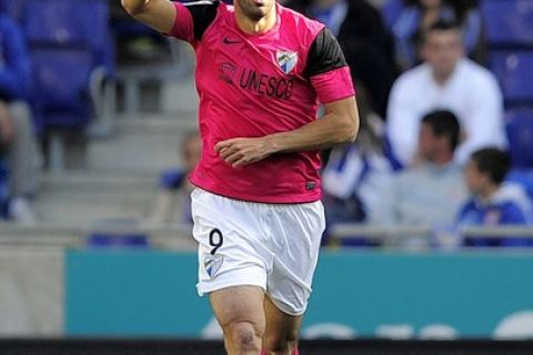 Malaga's Dutch forward Rutgerus Johannes Martinius van Nistelrooy celebrates his goal during the Spanish league football match RCD Espanyol vs Malaga CF on March 25, 2012 at the Cornella-El Prat stadium in Cornella.   AFP PHOTO/ JOSEP LAGO (Photo credit should read JOSEP LAGO/AFP/Getty Images)