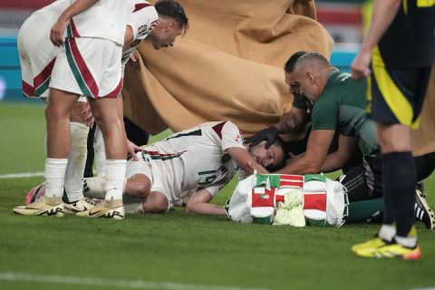 Hungary's Barnabas Varga is injured during a Group A match between Scotland and Hungary at the Euro 2024 soccer tournament in Stuttgart, Germany, Sunday, June 23, 2024. (AP Photo/Antonio Calanni)