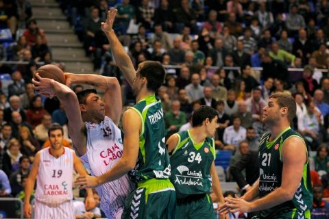 Caja Laboral's Uruguayan center Esteban Batista (L) vies with Unicaja's Serbian guard Uros Tripkovic (3rdR) during the Euroleague basketball match Unicaja vs Caja Laboral on January 20, 2011 at the Palacio de los Deportes Martin Carpena sportshall in Malaga.    AFP PHOTO/ JORGE GUERRERO (Photo credit should read Jorge Guerrero/AFP/Getty Images)