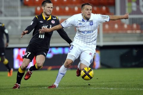 Auxerre's Polish midfielder Dariusz Dudka (R) vies with Lille's French midfielder Yohan Cabaye (L) during the French L1football match Auxerre vs Lille on February 6, 2011 at the Abbe-Deschamp stadium in Auxerre.  AFP PHOTO / JEFF PACHOUD (Photo credit should read JEFF PACHOUD/AFP/Getty Images)