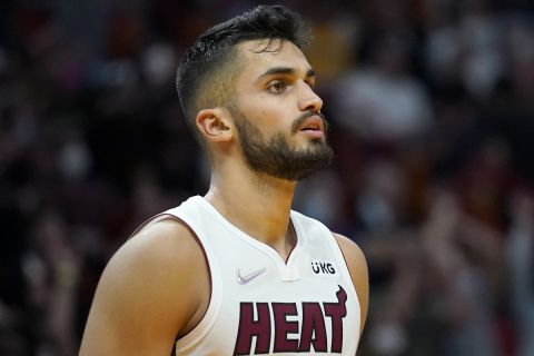 Miami Heat center Omer Yurtseven (77) stands on the court during the second half of an NBA basketball game against the Washington Wizards, Tuesday, Dec. 28, 2021, in Miami. The Heat won 119-112. (AP Photo/Lynne Sladky)