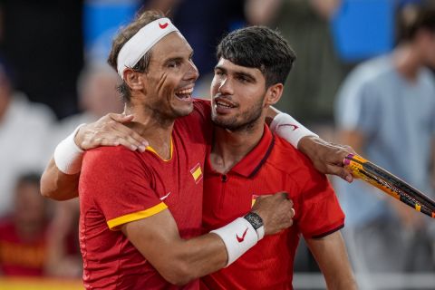 Rafael Nadal, left, and Carlos Alcaraz of Spain react after losing against Austin Krajicek and Rajeev Ram of the USA during the men's doubles quarter-final tennis competition at the Roland Garros stadium, at the 2024 Summer Olympics, Wednesday, July 31, 2024, in Paris, France. (AP Photo/Manu Fernandez)