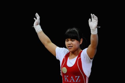 LONDON, ENGLAND - JULY 29:  Zulfiya Chinshanlo of Kazakhstan reacts after competing in the Women's 53kg Weightlifting on Day 2 of the London 2012 Olympic Games at ExCeL on July 29, 2012 in London, England.  (Photo by Laurence Griffiths/Getty Images)