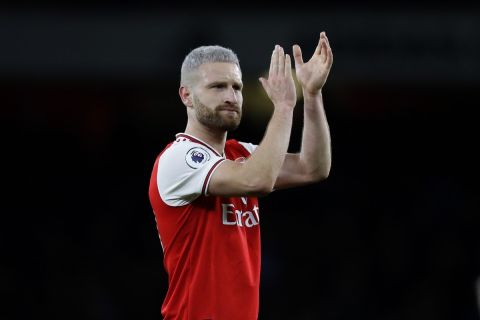 Arsenal's Shkodran Mustafi celebrates with fans at the end of the English Premier League soccer match between Arsenal and Everton at Emirates stadium in London, Sunday, Feb. 23, 2020. Arsenal won 3-2. (AP Photo/Kirsty Wigglesworth)