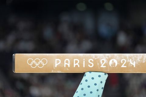 The Olympic logo is shown on the balance beam during a women's artistic gymnastics qualification round at the 2024 Summer Olympics, Sunday, July 28, 2024, in Paris, France. (AP Photo/Abbie Parr)