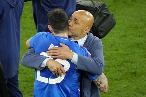 Italy's head coach Luciano Spalletti kisses Alessandro Bastoni at the end of a Group B match between Italy and Albania at the Euro 2024 soccer tournament in Dortmund, Germany, Saturday, June 15, 2024. (AP Photo/Andreea Alexandru)