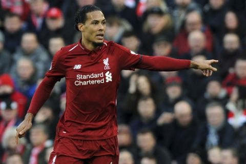 Liverpool's Virgil van Dijk gestures during the English Premier League soccer match between Liverpool and AFC Bournemouth at Anfield stadium in Liverpool, England, Saturday, Feb. 9, 2019. (AP Photo/Rui Vieira)