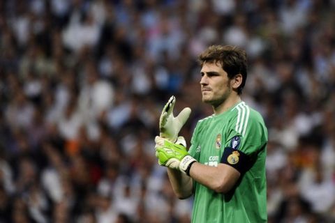 Real Madrid's goalkeeper and captain Iker Casillas gestures during the Champions League quarter-final first leg football match Real Madrid against Tottenham Hotspur at the Santiago Bernabeu stadium in Madrid, on April 5, 2011.  AFP PHOTO/ PIERRE -PHILIPPE MARCOU (Photo credit should read PIERRE-PHILIPPE MARCOU/AFP/Getty Images)