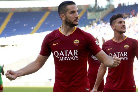 Roma's Kostas Manolas, left, and Lorenzo Pellegrini celebrate their side's 3-1 win at the end of the Serie A soccer match between Roma and Lazio, at the Rome Olympic Stadium, Saturday, Sept. 29, 2018. (AP Photo/Andrew Medichini)