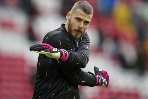 Manchester United's goalkeeper David de Gea warms-up ahead of the English Premier League soccer match between Liverpool and Manchester United at Anfield in Liverpool, England, Sunday, March 5, 2023. (AP Photo/Jon Super)