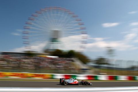 SUZUKA, JAPAN - OCTOBER 07:  Jenson Button of Great Britain and McLaren drives during practice for the Japanese Formula One Grand Prix at Suzuka Circuit on October 7, 2011 in Suzuka, Japan.  (Photo by Clive Mason/Getty Images)