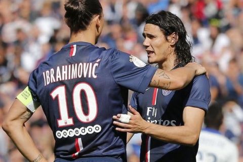 CAPTION CORRECTS THE YEAR - Paris Saint Germain's Zlatan Ibrahimovic, left, and Edinson Cavani, right, have a chat during a French League One soccer Match Paris Saint Germain against Bastia, at Parc des Princes stadium, in Paris, Saturday, Aug. 16. 2014. Paris Saint Germain won 2-0. (AP Photo/Michel Euler)