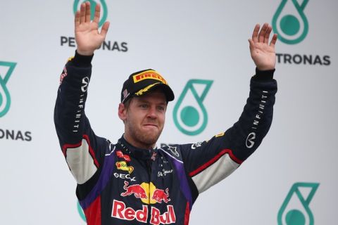 KUALA LUMPUR, MALAYSIA - MARCH 30:  Third placed Sebastian Vettel of Germany and Infiniti Red Bull Racing celebrates on the podium after the Malaysia Formula One Grand Prix at the Sepang Circuit on March 30, 2014 in Kuala Lumpur, Malaysia.  (Photo by Clive Mason/Getty Images) *** Local Caption *** Sebastian Vettel