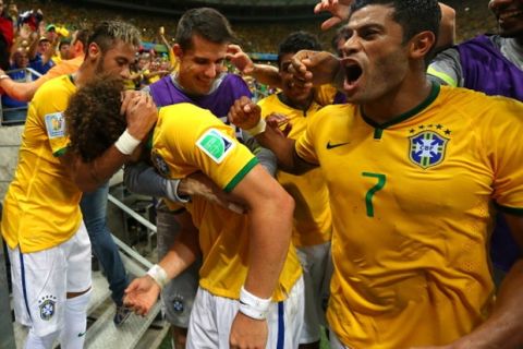 FORTALEZA, BRAZIL - JULY 04:  David Luiz (C) of Brazil celebrates scoring his team's second goal with his teammates Neymar (L), Hulk (R) and teammates during the 2014 FIFA World Cup Brazil Quarter Final match between Brazil and Colombia at Estadio Castelao on July 4, 2014 in Fortaleza, Brazil.  (Photo by Alex Livesey - FIFA/FIFA via Getty Images)