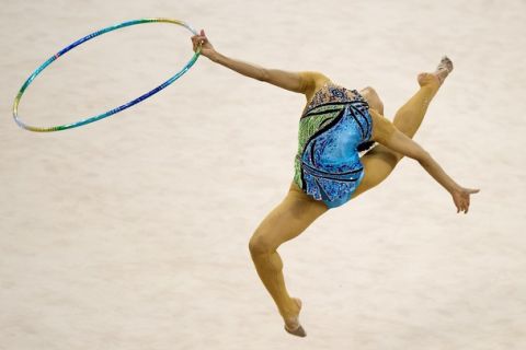 Yuria Onuki of Japan performs during the rhythmic gymnastics individual all-around qualification & team final at the 16th Asian Games on November 25, 2010. AFP PHOTO/ Nicolas ASFOURI (Photo credit should read NICOLAS ASFOURI/AFP/Getty Images)