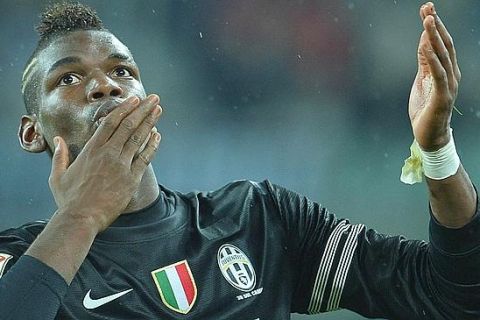 Juventus' French midfielder Paul Pogba celebrates after scoring during the Italian Serie A football match between Juventus and Bologna on October 31, 2012. at the Juventus stadium in Turin.  AFP PHOTO / ALBERTO PIZZOLI
