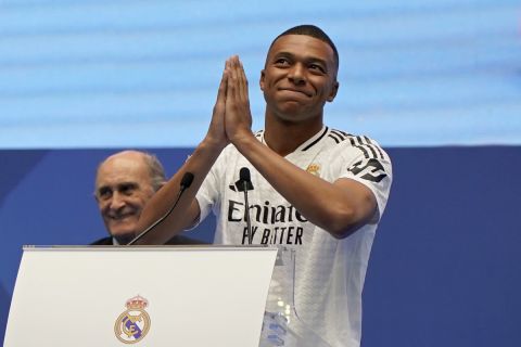 Kylian Mbappe, of France, gestures as he is presented to fans as a new Real Madrid player at the Santiago Bernabeu stadium in Madrid, Tuesday, July 16, 2024. (AP Photo/Andrea Comas)