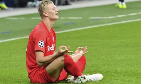 Salzburg's Erling Braut Haaland, left, celebrates after scoring the opening goal during the Champions League Group E soccer match between FC Red Bull Salzburg and Napoli in Salzburg, Austria, Wednesday, Oct. 23, 2019. (AP Photo/Kerstin Joensson)