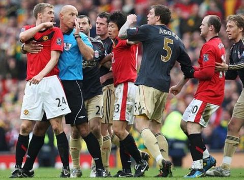 Football - Manchester United v Liverpool Barclays Premier League  - Old Trafford - 09/10 -  21/3/10
Manchester United's Darren Fletcher (L) is restrained by referee Howard Webb (2nd L) after clashing with Liverpool's Dirk Kuyt (not pictured) and Daniel Agger (C)
Mandatory Credit: Action Images / Carl Recine
Livepic
NO ONLINE/INTERNET USE WITHOUT A LICENCE FROM THE FOOTBALL DATA CO LTD. FOR LICENCE ENQUIRIES PLEASE TELEPHONE +44 (0) 207 864 9000.