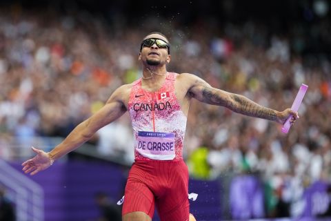 Andre de Grasse, of Canada, celebrates after winning the men's 4 x 100-meter relay final at the 2024 Summer Olympics, Friday, Aug. 9, 2024, in Saint-Denis, France. (AP Photo/Petr David Josek)