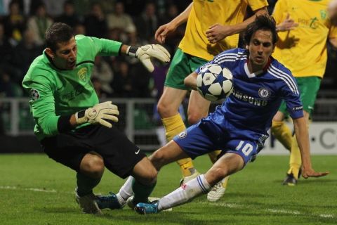 ZILINA, SLOVAKIA - SEPTEMBER 15:  Martin Dubravka of MSK Zilina clashes with Yossi Benayoun of Chelsea during the UEFA Champions League Group F match between MSK Zilina and Chelsea at the Pod Dubnom Stadium on September 15, 2010 in Zilina, Slovakia.  (Photo by Hamish Blair/Getty Images)