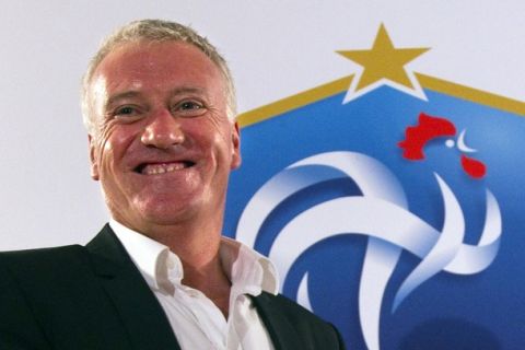 Didier Deschamps, France's newly appointed national soccer team coach, smiles during his first news conference at the French Football Federation headquarters in Paris July 9, 2012. Deschamps was appointed France coach on Sunday, the latest 1998 World Cup winner to be handed the difficult task of moulding a group of argumentative players into the successful team their skills often promise.    REUTERS/Charles Platiau  (FRANCE - Tags: SPORT SOCCER HEADSHOT)