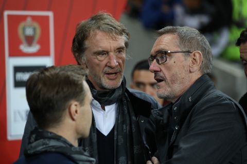 Sir Jim Ratcliffe and his brother Bob Ratcliffe talk ahead of the French League One soccer match between Nice and Paris Saint Germain in Allianz Riviera stadium in Nice, southern France, Friday, Oct.18, 2019. (AP Photo/Daniel Cole)
