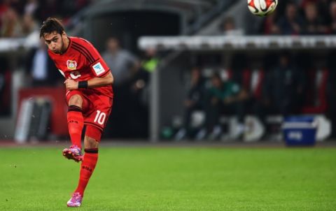 LEVERKUSEN, GERMANY - SEPTEMBER 12:  Hakan Calhanoglu of Bayer Leverkusen scores their second goal from  a free kick during the Bundesliga match between Bayer 04 Leverkusen and Werder Bremen at BayArena on September 12, 2014 in Leverkusen, Germany.  (Photo by Dennis Grombkowski/Bongarts/Getty Images)