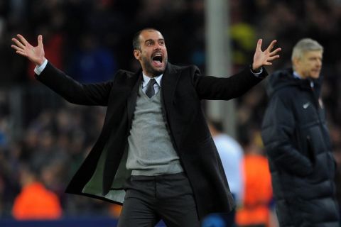 Barcelona's coach Pep Guardiola celebrates after his team scores a goal during their Champions League round of 16, 2nd leg football match FC Barcelona vs Arsenal on March 8, 2011 at Camp Nou stadium in Barcelona. AFP PHOTO / LLUIS GENE (Photo credit should read LLUIS GENE/AFP/Getty Images)