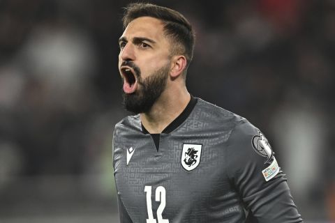 FILE - Georgia goalkeeper Giorgi Mamardashvili reacts after his save during a penalty shootout at the end of the Euro 2024 qualifying play-off soccer match between Georgia and Greece at the Boris Paichadze National Stadium in Tbilisi, Georgia, Tuesday, March 26, 2024. (AP Photo/Tamuna Kulumbegashvili, File)