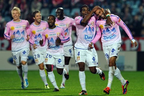 Evian's Tunisian forward Saber Khalifa (R) is congratuled by teammates after scoring a goal during the French L1 football match Lille vs Evian-Thonon on November 5, 2011 at Lille metropole stadium in Villeneuve d'Ascq. AFP PHOTO PHILIPPE HUGUEN (Photo credit should read PHILIPPE HUGUEN/AFP/Getty Images)