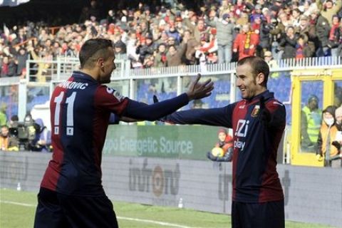 Genoa's Rodrigo Palacio, right, of Argentina, celebrates with his Serbian teammate Bosko Jankovic, after scoring during a Serie A soccer match between Genoa and Lazio, at Genoa's Luigi Ferraris stadium, Italy, Sunday, Feb. 5, 2012. (AP Photo/Francesco Pecoraro, Lapresse) ITALY OUT