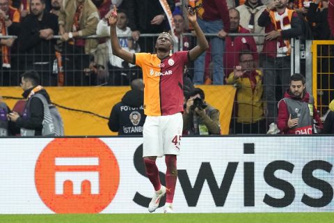 Galatasaray's Victor Osimhen celebrates after scoring his side's second goal during the Europa League opening phase soccer match between Galatasaray and Tottenham Hotspur at Ali Sami Yen stadium, in Istanbul, Turkey, Thursday, Nov. 7, 2024. (AP Photo/Khalil Hamra)