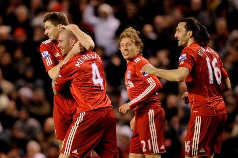 LIVERPOOL, ENGLAND - FEBRUARY 02:  Raul Meireles of Liverpool celebrates with his team mates after scoring the opening goal during the Barclays Premier League match between Liverpool and Stoke City at Anfield on February 2, 2011 in Liverpool, England.  (Photo by Michael Regan/Getty Images)