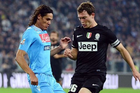 Juventus' Swiss defender Stephan Lichtseiner  (R) fights for the ball with Napoli's Uruguayan forward Edinson Roberto Cavani during the Serie A football match between Juventus and Naples on October 20, 2012  at the Alps stadium in Turin. AFP PHOTO / OLIVIER MORIN        (Photo credit should read OLIVIER MORIN/AFP/Getty Images)