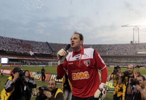 Sao Paulo FC' s goalkeeper Rogerio Ceni, top, speaks to supporters at the end of a Brazilian soccer league game against Atletico Mineiro in Sao Paulo, Brazil, Wednesday, Sept. 7, 2011. Ceni played the 1000th game for his team, Sao Paulo that won 2-1. (AP Photo/Andre Penner)