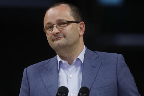 International Olympic Committee Evaluation Commission Chair Patrick Baumann listens to questions from the media during a news conference at Staples Center, Friday, May 12, 2017, in Los Angeles. The IOC officials wrapped up four days of evaluating Los Angeles' bid for the 2024 Games before heading to Paris to check the only other candidate. (AP Photo/Jae C. Hong)