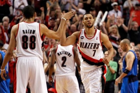 PORTLAND, OR - APRIL 23:  Brandon Roy #7 high fives Nicolas Batum #88 of the Portland Trail Blazers against the Dallas Mavericks in Game Four of the Western Conference Quarterfinals in the 2011 NBA Playoffs on April 23, 2011 at the Rose Garden in Portland, Oregon. NOTE TO USER: User expressly acknowledges and agrees that, by downloading and or using this photograph, User is consenting to the terms and conditions of the Getty Images License Agreement.  (Photo by Jonathan Ferrey/Getty Images)