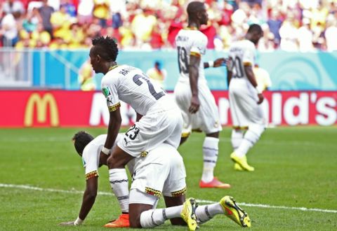 BRASILIA, BRAZIL - JUNE 26:  Harrison Afful consoles John Boye of Ghana after he scored an own goal during the 2014 FIFA World Cup Brazil Group G match between Portugal and Ghana at Estadio Nacional on June 26, 2014 in Brasilia, Brazil.  (Photo by Adam Pretty/Getty Images)